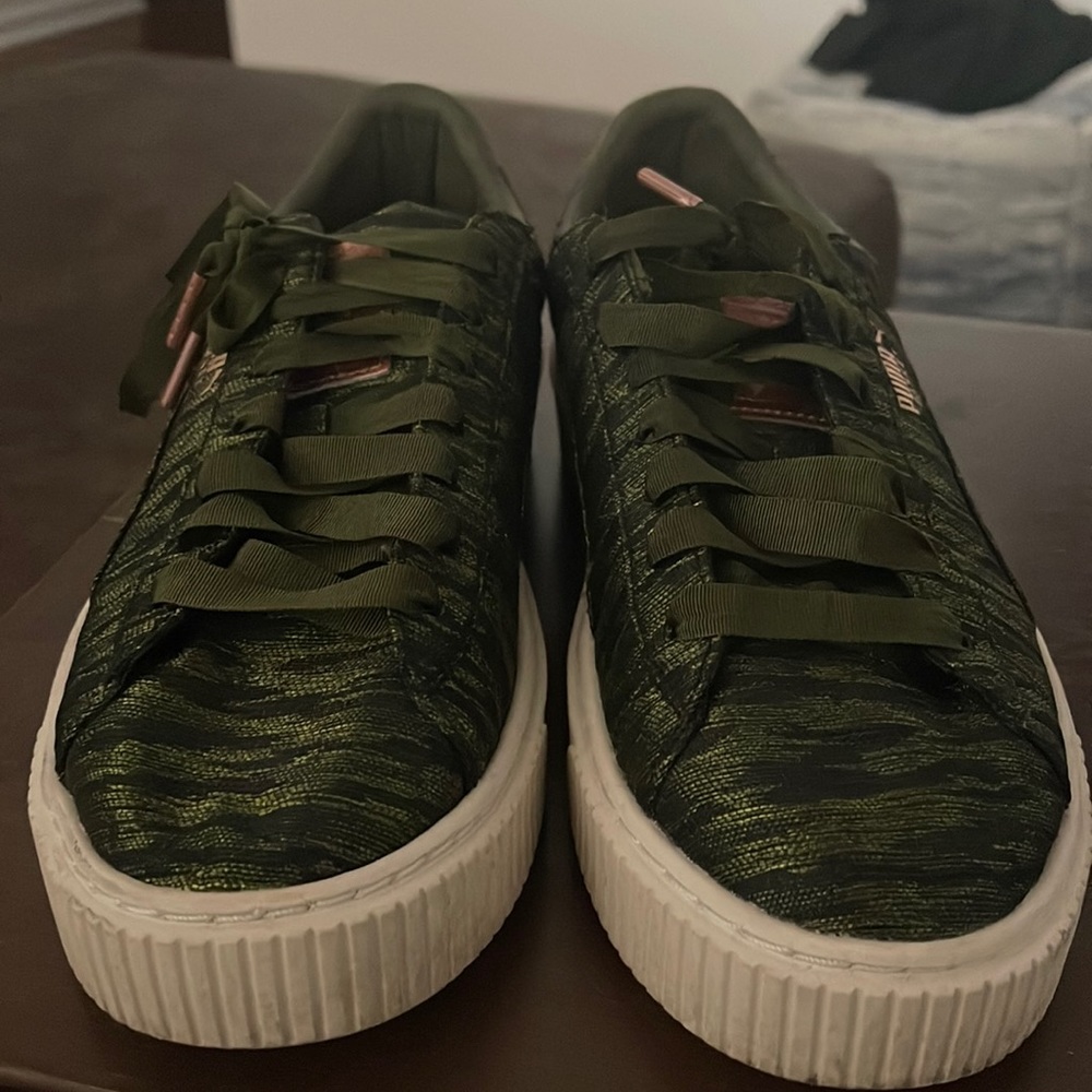 Army green and black puma sneakers